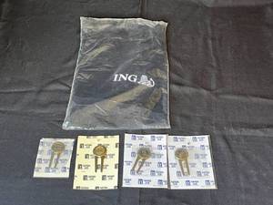 lot 215 image: Level 23 - Lot of ING Branded Golf Towel and PGA Tour Partners Club Divot Tools