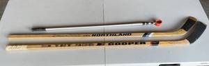 lot 327 image: Garage - Lot of 2 Vintage Hockey Sticks and 1 Ball Hockey Stick