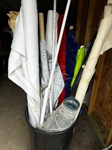 lot 114 image: Remnants in a can Oscar the Grouch would be ecstatic with this buy. Large Variety of Bolt Rolls of High End Fabric Perfect for Costumes