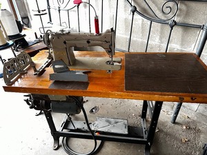 lot 121 image: Fully functional Pfaff industrial sewing machine modified to operate with electric motor drive. David used these to create  theatrical & period clothing and costumes. This was used to sew leather, wool, and very heavy fabrics.