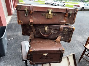 lot 124 image: Four Antique Leather Trunks Suitcases