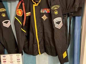 lot 1 image: Welcome to the Royal Manticoran Navy - Lot includes two complete Manticore Navy Uniforms, 5 berets, MP & CO Arm Band, 4 Challenge Coins, Dueling Pistols, Replica Pulsar Sidearm, Badges and more See photos for all items