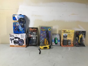 lot 64 image: New spotlight, emergency tool, backpack expedition stove, flashlights, lantern and travel shower