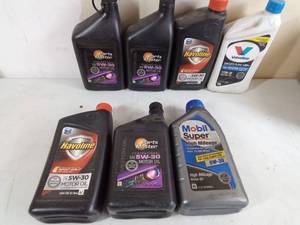 lot 280 image: 5W-30 Oil  4 full quarts, 3 partial quarts