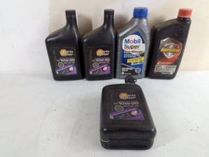 lot 282 image: 10W-30 Oil  4 full quarts, 1 Partial quart