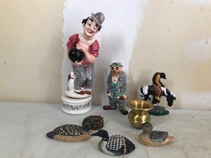 lot 131 image: 2 ceramic & 1 wood Loon, Mini Spittoon, Metal Train & metal horse with rider & clown musical liquor bottle