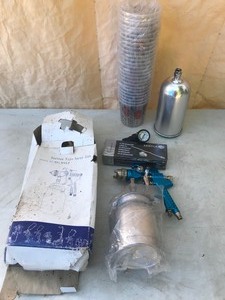lot 224 image: Suction type Paint Spraying Gun. Measuring cups & Repair Kit