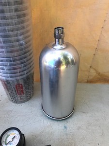 lot 337 image: Paint cups and canaster and regulator