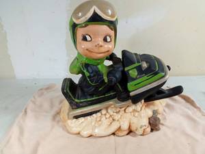 lot 249 image: Ceramic snowmobile with rider
