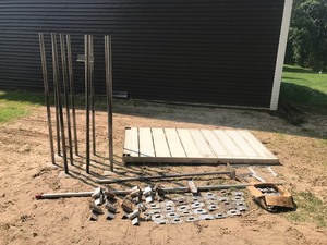 lot 321 image: Aluminum 4x8 Dock section with 12 aluminum poles (one is bent)