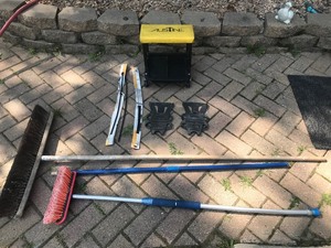 lot 17 image: Mechanics wheeled stool, ice cleats, door edge broom, shop broom, brush that hooks up to hose for cleaning vehicles