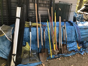 lot 368 image: Roll of plastic, roll out truck top cover, shovels, rake, post hole digger, pitchfork, broom, pry bar