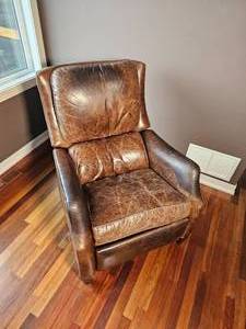 lot 56 image: Distressed Brown Leather Recliner Armchair