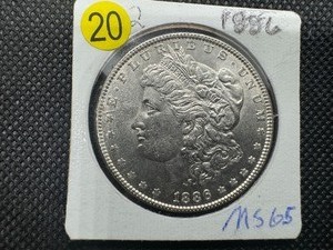 lot 20 image: 1886 Morgan Silver Dollar Marked MS65 When Purchased