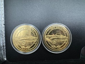 lot 95 image: Two 24 Karat Gold Plated 1956 Corvette Coins