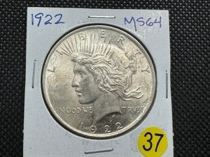 lot 37 image: 1922 Peace Silver Dollar Marked MS64 When Purchased