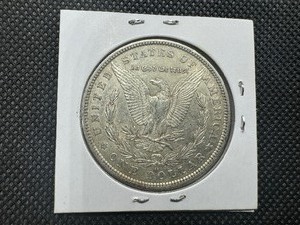 lot 6 image: 1879-O Morgan Silver Dollar  Marked AU When Purchased