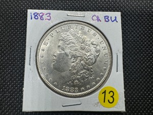 lot 13 image: 1883  Morgan Silver Dollar Marked Choice BU When Purchased