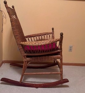 lot 87 image: 1920s Antique Rocking Rattan Rocking Chair with Cushion