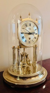 lot 85 image: Nissin Clock Co - Elgin - Magic Eye Clock Gold