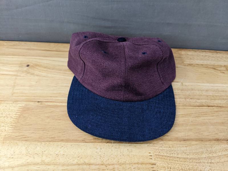 lot 151B image: 48 Brand New Yupoong Plum and Navy Hats OSFM A
