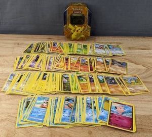 lot 18 image: Pokemon Trading Card Game Tin with Cards M