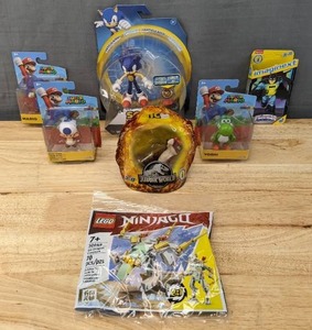 lot 32 image: Brand New Imaginext Batman Figure, Lego Ninjago, Jurassic World Dino Figure, (3) Super Mario Figures, Sonic the Hedgehog Figure F