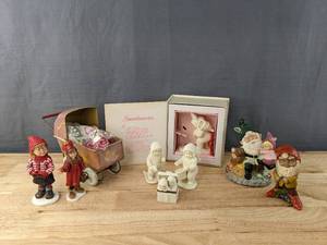 lot 42 image: Collection of Decorative Figurines for Christmas, Winter and More Deptarment 56, Gnome, Norwegian Sweater Kids Girl and More M