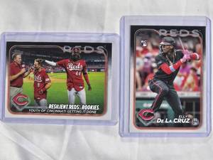 lot 54 image: Lot of 2 Elly De La Cruz Rookie Cards 2024 Topps #141 & 2024 Resilient Reds Rookies Checklist #133 with Matt McLain
