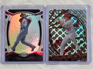 lot 65 image: Lot of 2 Mike Trout Foil Inserts 2022 Panini Chronicles Revolution #68 & 2021 Panini Chronicles Certified #15
