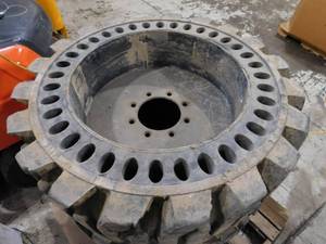 lot 10A image: Set of Solid Pneumatic Skid Steer Tires with Rims 12 - 16.5