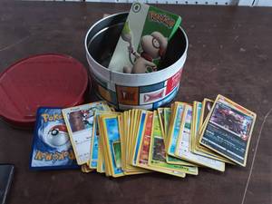 lot 47 image: Tin Of Pokemon Trading Cards