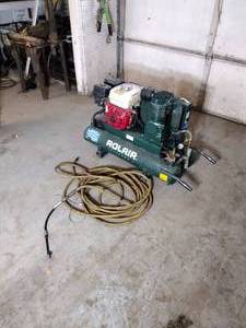 lot 111 image: Rolaire Air Compressor 6 12 hp Honda engine with hose. Model 6590HK18. Gas