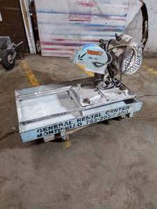lot 61A image: Block Tile Saw, electric. floor dolly included. Engine starts up
