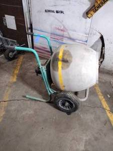 lot 72D image: Push cement mixer with electric motor starts up