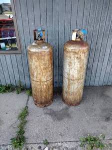 lot 393 image: 2 tanks  cylinders approx 5 foot High for liquified petroleum gas.