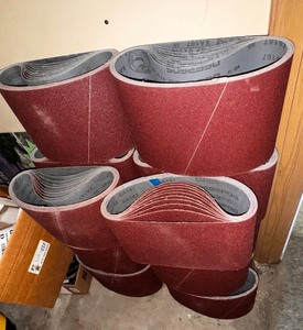 lot 141A image: Large lot of Deerfos XA167 Aluminum Oxide Resin Cloth Belt Abrasive sleeve.