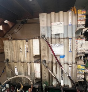 lot 416 image: Stackable poly oil storage tanks and manual fluid evacuators.