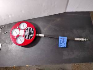 lot 156A image: Mico quadrigage Model 02740016 consists of three interconnected pressure gauges in a single metal housing.