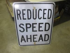 lot 188 image: (BR1) Retired Reduced Speed Ahead Road Sign 30 x 24