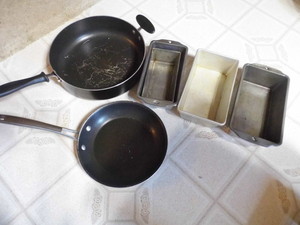 2 frying pans plus 6 metal loaf pan...