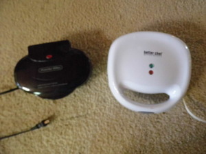 2 sandwich grills 1 sm, 1 lg...