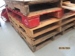 Short stack of wood pallets plus ad...