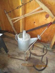Antique buck saw, hand scythe, sling blade