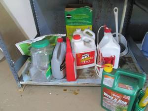 Shelf filled with lawn care product...
