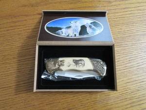 Commemorative folding knife in a wo...