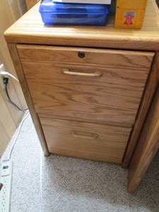 Wood file cabinet with key...