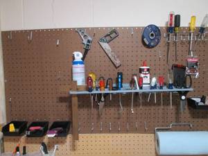 Assorted tools and peg board hooks...