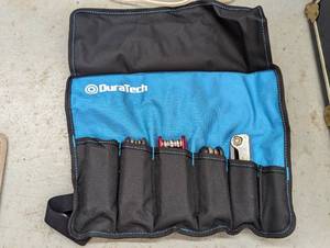 Roll up tool case with a variety of...