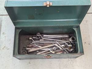 Green metal toolbox with a variety ...